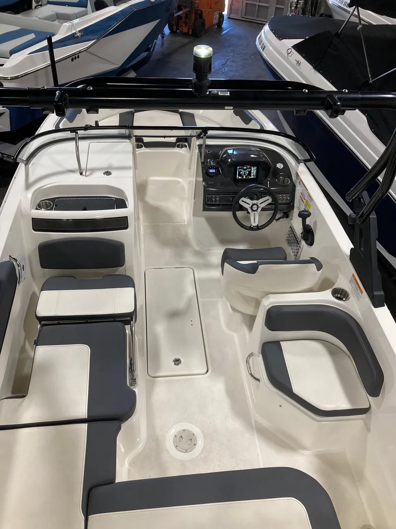 Slide: The Image of 2020 Bayliner VR6 boat interior with seating and steering console. - 9
