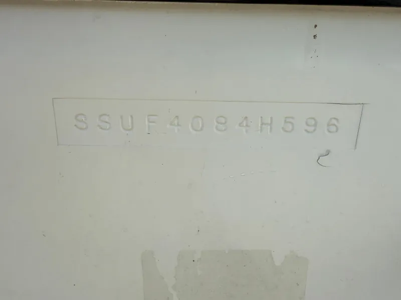 Slide: The Image of Hull identification number on a 1996 Pursuit 2460 Denali boat. - 27