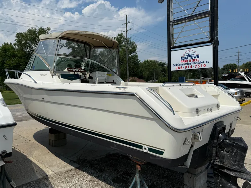 Slide: The Image of 1996 Pursuit 2460 Denali boat displayed at Boat Town Park N Sell. - 6