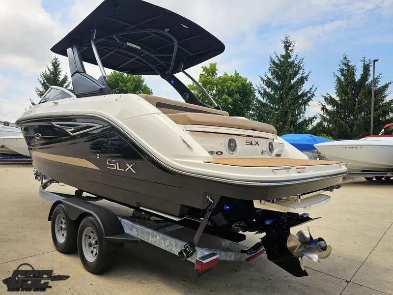 Slide: The Image of 2016 Sea Ray 250 SLX boat on trailer, featuring sleek design and modern amenities. - 23