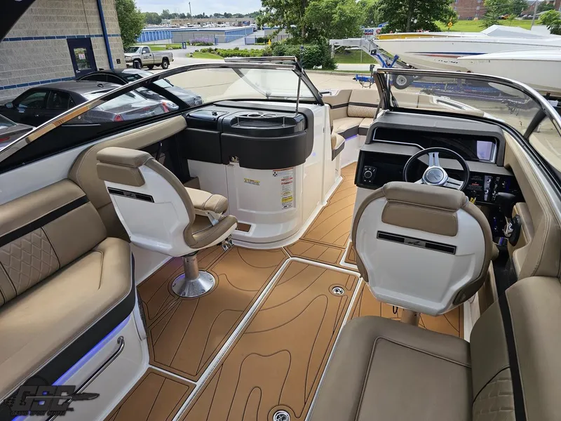 Slide: The Image of Interior of a 2016 Sea Ray 250 SLX boat with luxurious seating and modern dashboard. - 39