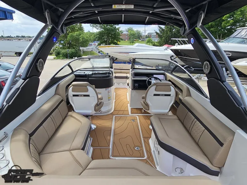 Slide: The Image of Interior of a 2016 Sea Ray 250 SLX boat with luxurious seating and modern design. - 40