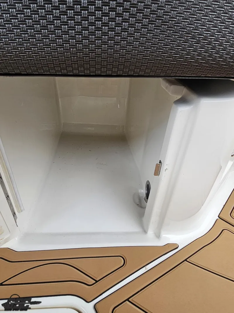 Slide: The Image of Storage compartment on a 2016 Sea Ray 250 SLX boat with textured flooring. - 47