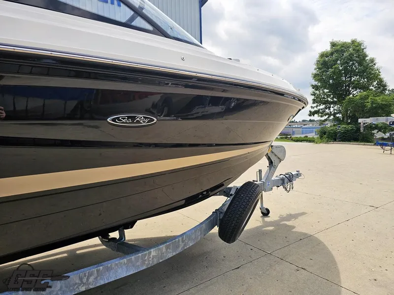 Slide: The Image of 2016 Sea Ray 250 SLX boat on trailer, parked outdoors. - 6