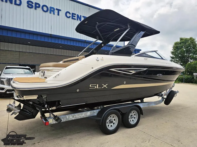 Slide: The Image of 2016 Sea Ray 250 SLX boat on trailer at dealership, side view. - 9