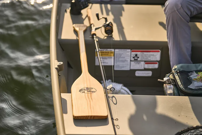 Slide: The Image of Manufacturer Provided Image: 2026 Tracker Grizzly 10 Jon boat with paddle and fishing rod on board. - 19