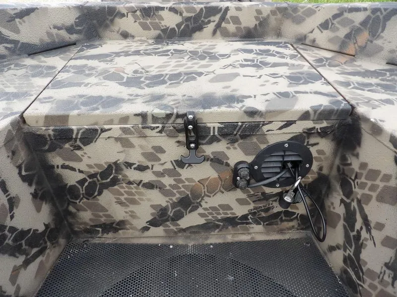 Slide: The Image of Camouflage-patterned Havoc VJST-C 1756 boat interior, 2021 model, featuring storage compartment and wiring. - 10