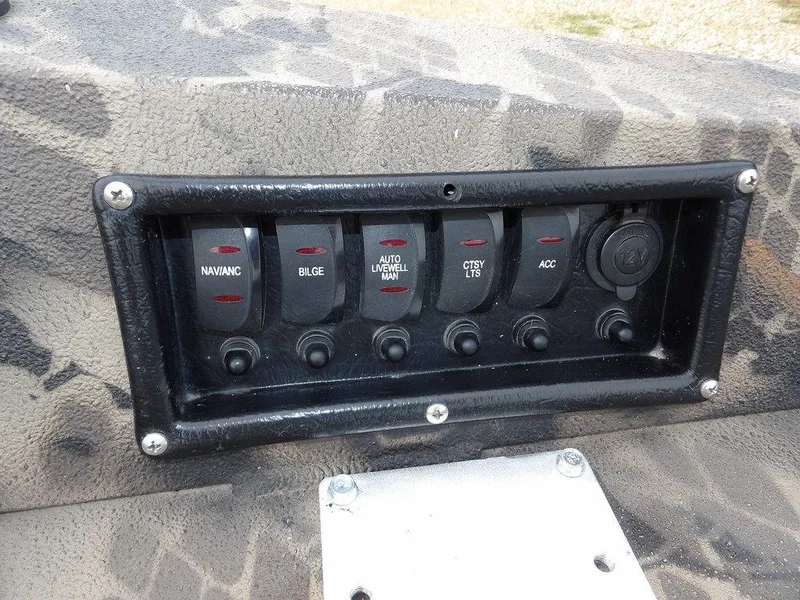 Slide: The Image of Control panel of a 2021 Havoc VJST-C 1756 boat with labeled switches. - 14