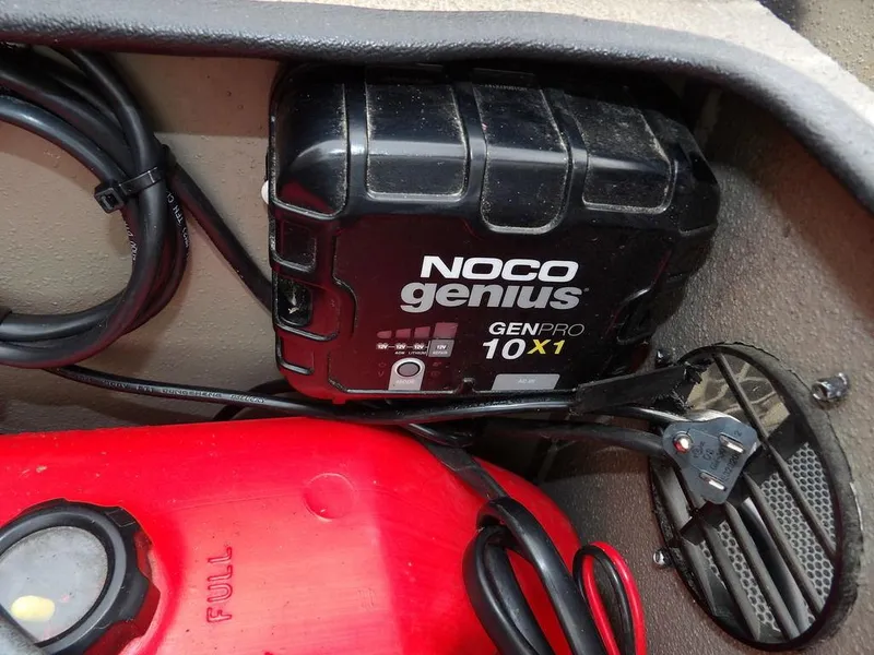 Slide: The Image of NOCO Genius GENPRO 10X1 charger in Havoc VJST-C 1756, 2021 model, with red fuel tank. - 23