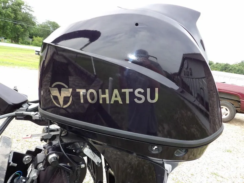 Slide: The Image of Tohatsu outboard motor on a 2021 Havoc VJST-C 1756 boat, parked outdoors. - 25