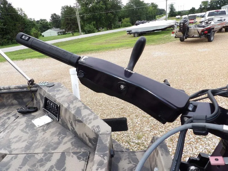 Slide: The Image of Boat control panel with Havoc VJST-C 1756 tiller handle, 2021 model, in a camo-patterned interior. - 27