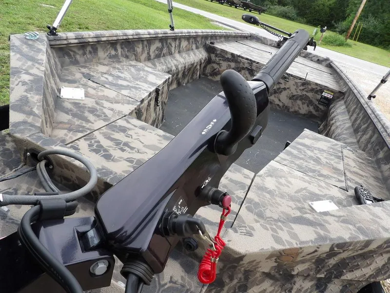 Slide: The Image of Camouflage-patterned interior of a 2021 Havoc VJST-C 1756 boat with steering controls. - 29