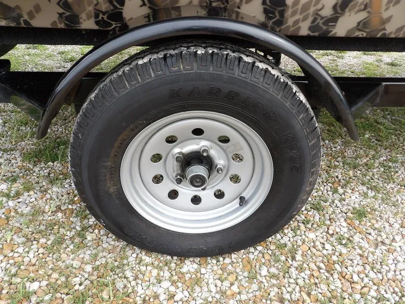 Slide: The Image of Trailer wheel with KARRIER tire on Havoc VJST-C 1756, 2021 model, on gravel surface. - 36