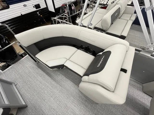 Slide: The Image of 2025 Harris Cruiser 210 boat interior with plush seating and modern design. - 11