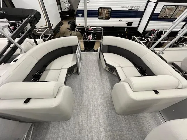 Slide: The Image of 2025 Harris Cruiser 210 pontoon boat interior with plush seating and modern design. - 12