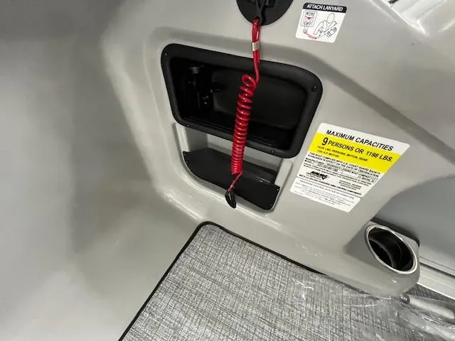 Slide: The Image of 2025 Harris Cruiser 210 interior with safety lanyard and capacity warning label. - 13