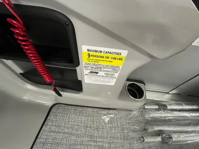 Slide: The Image of Interior of 2025 Harris Cruiser 210 showing capacity label and safety features. - 14