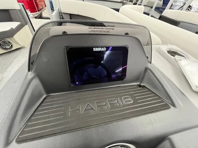 Slide: The Image of 2025 Harris Cruiser 210 dashboard with Simrad display and sleek interior design. - 18