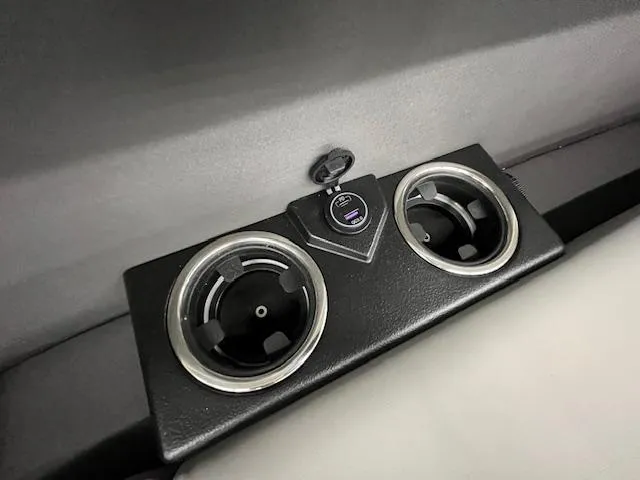 Slide: The Image of Cup holders and USB port in 2025 Harris Cruiser 210 boat interior. - 22