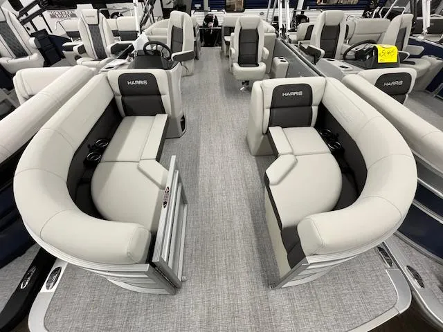 Slide: The Image of 2025 Harris Cruiser 210 pontoon boat interior with plush seating and modern design. - 4