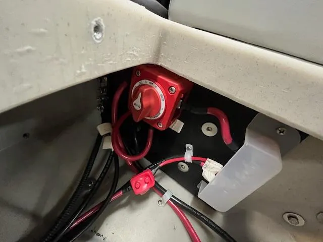 Slide: The Image of Battery switch and wiring inside 2025 Harris Cruiser 210 boat. - 7