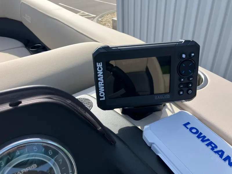 Slide: The Image of Lowrance Eagle 5 device on 2025 Harris Cruiser 230 boat dashboard. - 14