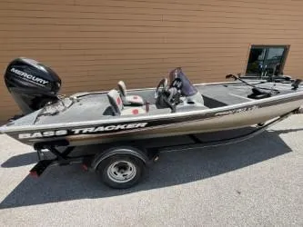 Slide: The Image of 2015 Tracker Pro 170 bass boat with Mercury engine, parked outdoors. - 6