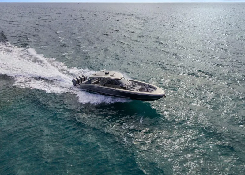 Slide: The Image of 2024 Mystic Powerboats M5200 cruising on open water, showcasing sleek design and powerful performance. - 19