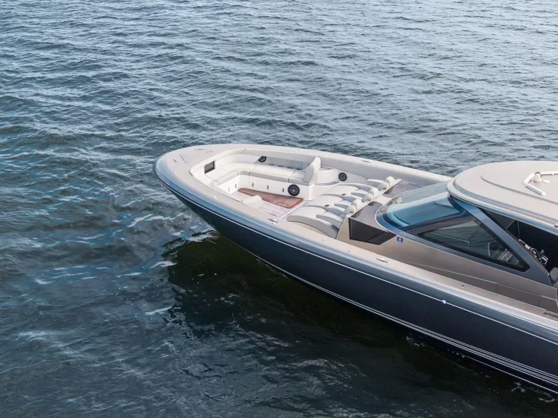 Slide: The Image of 2024 Mystic Powerboats M5200 cruising on open water, showcasing sleek design and luxury features. - 30
