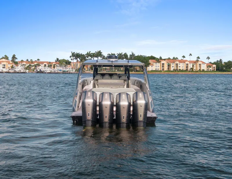 Slide: The Image of 2024 Mystic Powerboats M5200 on water, showcasing powerful engines and sleek design. - 43