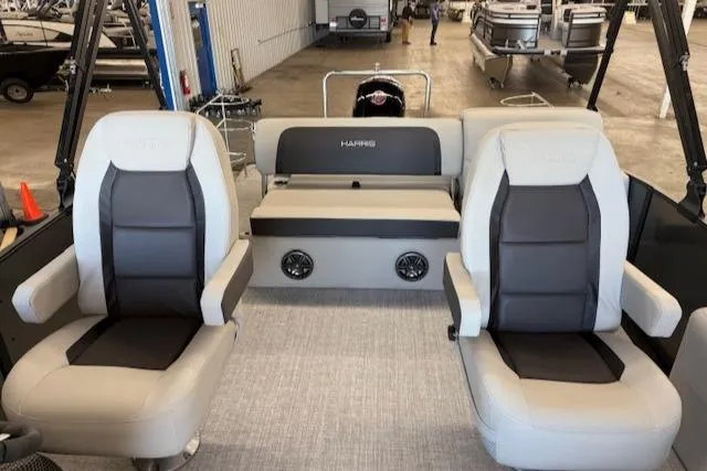 Slide: The Image of 2025 Harris Cruiser 230 boat interior with two seats and a central console. - 13