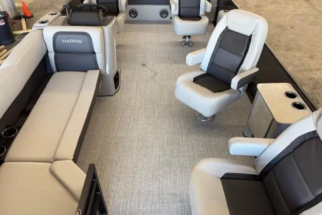 Slide: The Image of Interior of 2025 Harris Cruiser 230 boat with plush seating and modern design. - 16