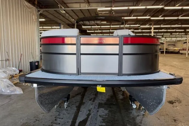Slide: The Image of 2025 Harris Cruiser 230 pontoon boat in a warehouse setting. - 3