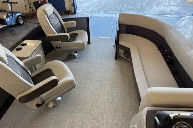 Slide: The Image of 2025 Harris Cruiser 230 interior with plush seating and modern design. - 7