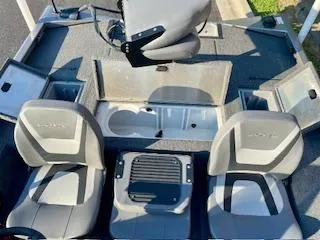 Slide: The Image of 2025 Lowe 175 Stinger boat interior with seating and storage compartments. - 11