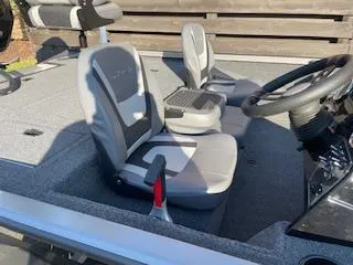 Slide: The Image of 2025 Lowe 175 Stinger boat interior with two seats and steering wheel. - 6