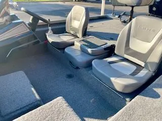 Slide: The Image of 2025 Lowe 175 Stinger boat interior with two gray seats and carpeted flooring. - 8