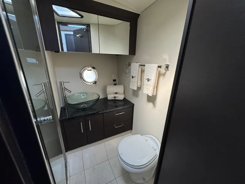 Slide: The Image of Luxurious bathroom in 2014 Marquis 420 Sport Bridge yacht with modern fixtures. - 12