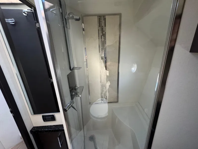 Slide: The Image of Modern bathroom in 2014 Marquis 420 Sport Bridge yacht with glass shower enclosure. - 14