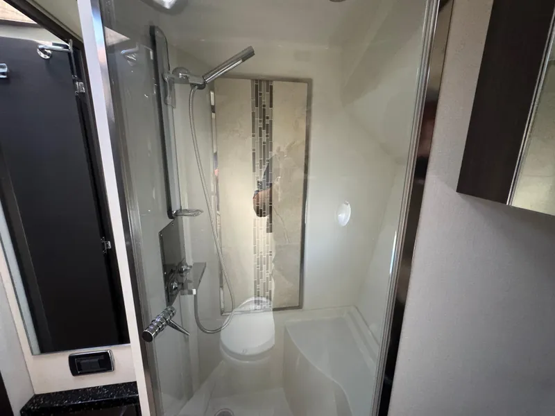Slide: The Image of Shower area in 2014 Marquis 420 Sport Bridge yacht, featuring modern fixtures and sleek design. - 15