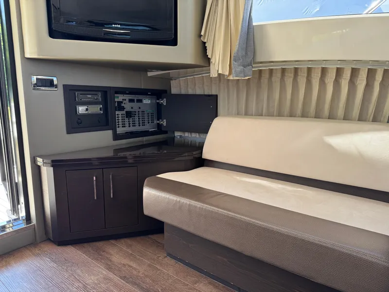 Slide: The Image of Interior of 2014 Marquis 420 Sport Bridge with seating, control panel, and TV. - 26