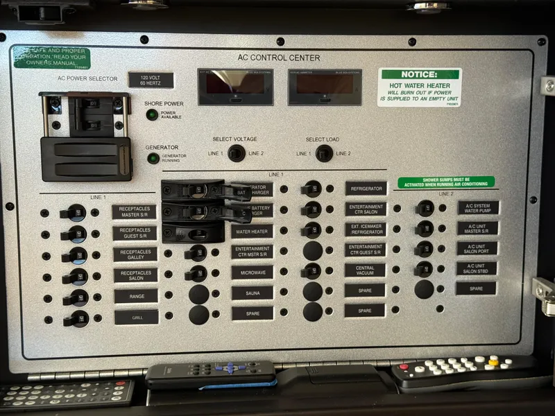 Slide: The Image of 2014 Marquis 420 Sport Bridge AC control panel with switches and labels. - 27