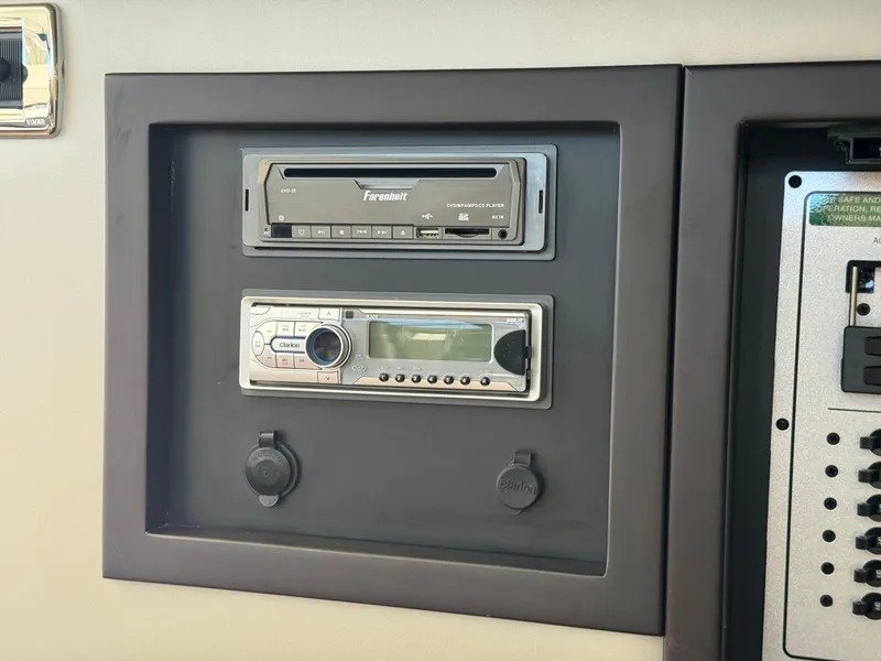 Slide: The Image of Control panel with audio system on 2014 Marquis 420 Sport Bridge yacht. - 28