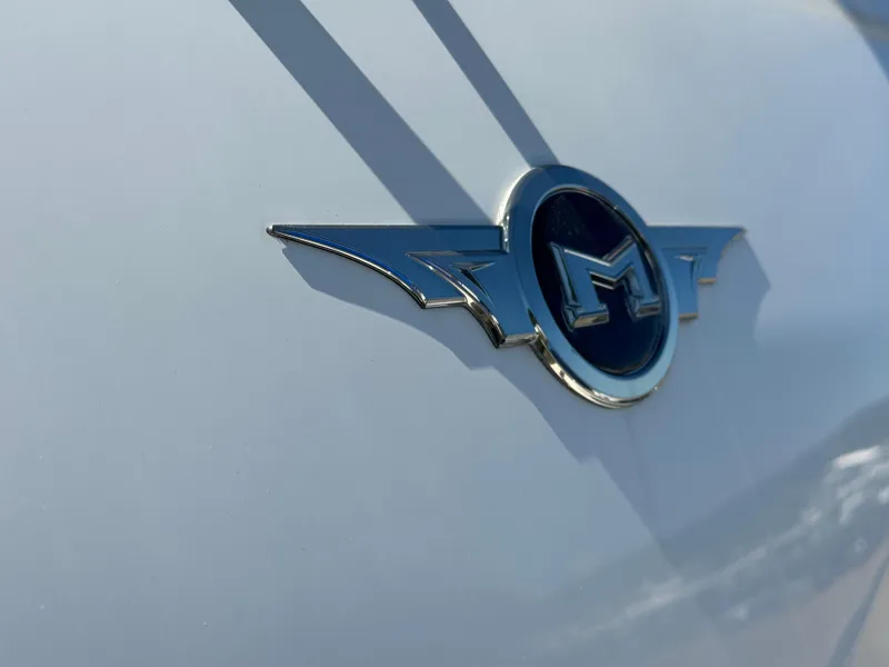 Slide: The Image of Marquis 420 Sport Bridge 2014 emblem on a sleek white surface. - 40