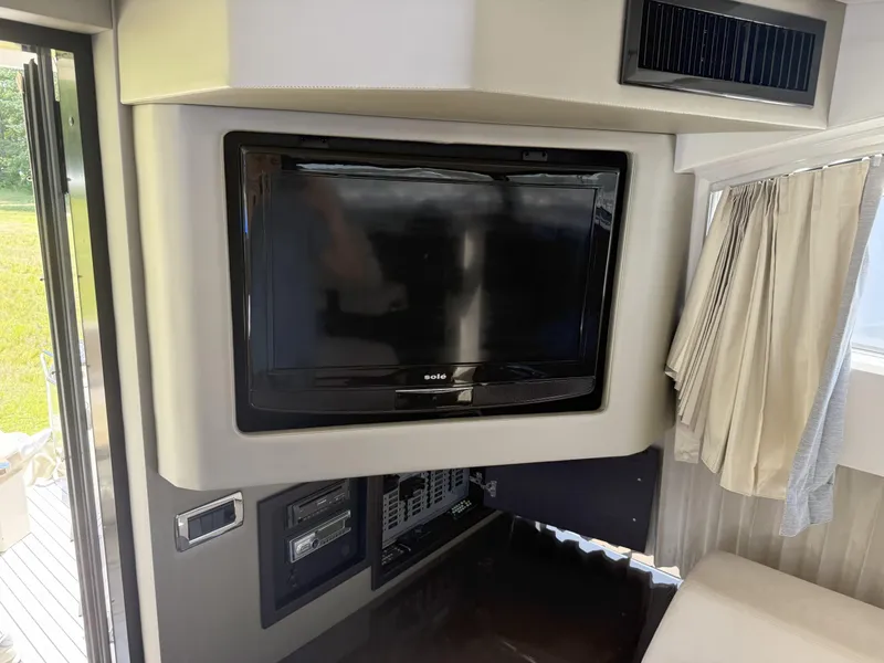 Slide: The Image of Interior of 2014 Marquis 420 Sport Bridge with TV and control panel. - 46