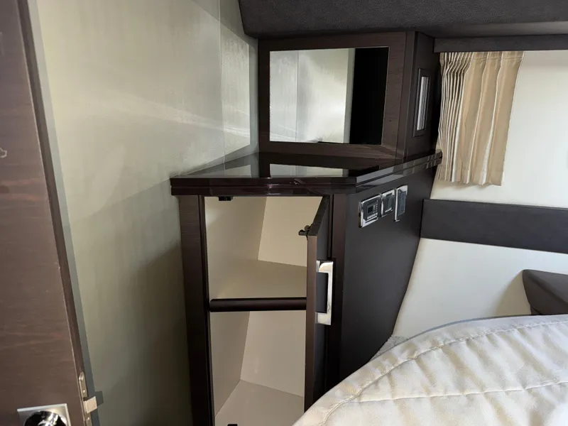 Slide: The Image of Interior of 2014 Marquis 420 Sport Bridge with open cabinet and modern design. - 7