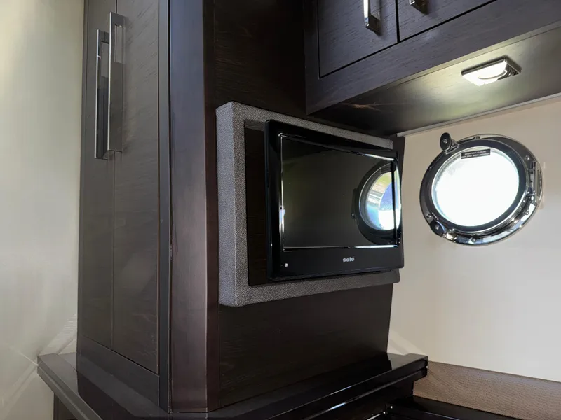 Slide: The Image of Interior of 2014 Marquis 420 Sport Bridge with TV and porthole window. - 9