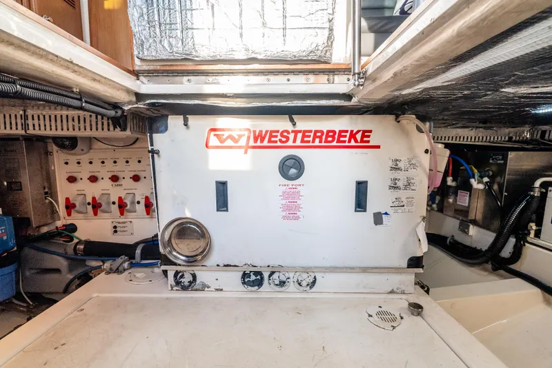 Slide: The Image of Engine room of 2002 Cabo 35 Flybridge with Westerbeke generator. - 35