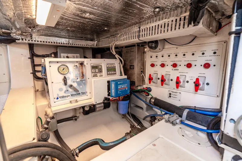 Slide: The Image of Electrical control panel in a 2002 Cabo 35 Flybridge boat engine room. - 36