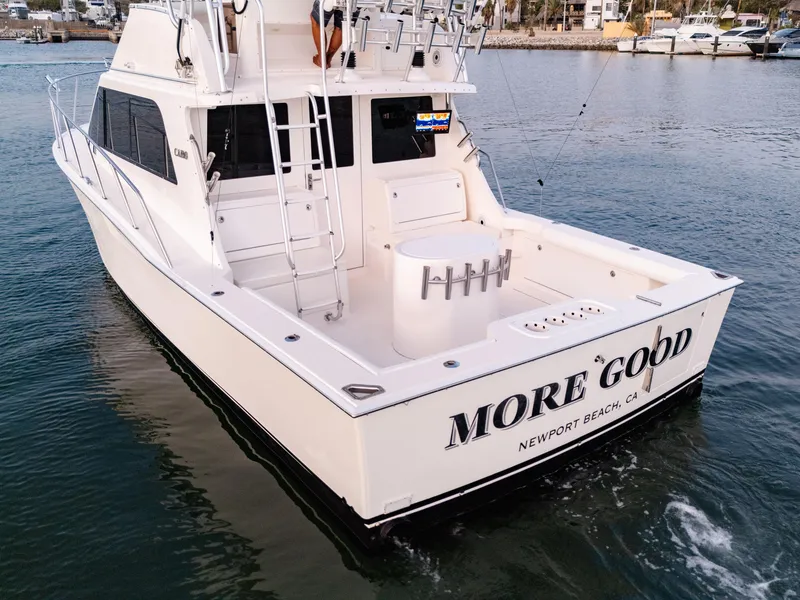 Slide: The Image of 2002 Cabo 35 Flybridge boat named "More Good" in Newport Beach, CA, on the water. - 6